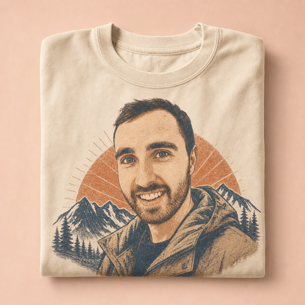 A folded cream T-shirt printed with a stylized portrait of Connor in front of mountains